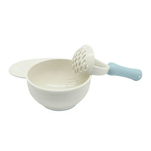 Load image into Gallery viewer, A blue baby food masher is with food Masher bowl with blue nonslip base.
