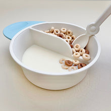 Load image into Gallery viewer, Os pushed into milk in fun bowl.
