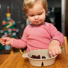 Load image into Gallery viewer, Baby girl eats snacks from sectioned bowl.
